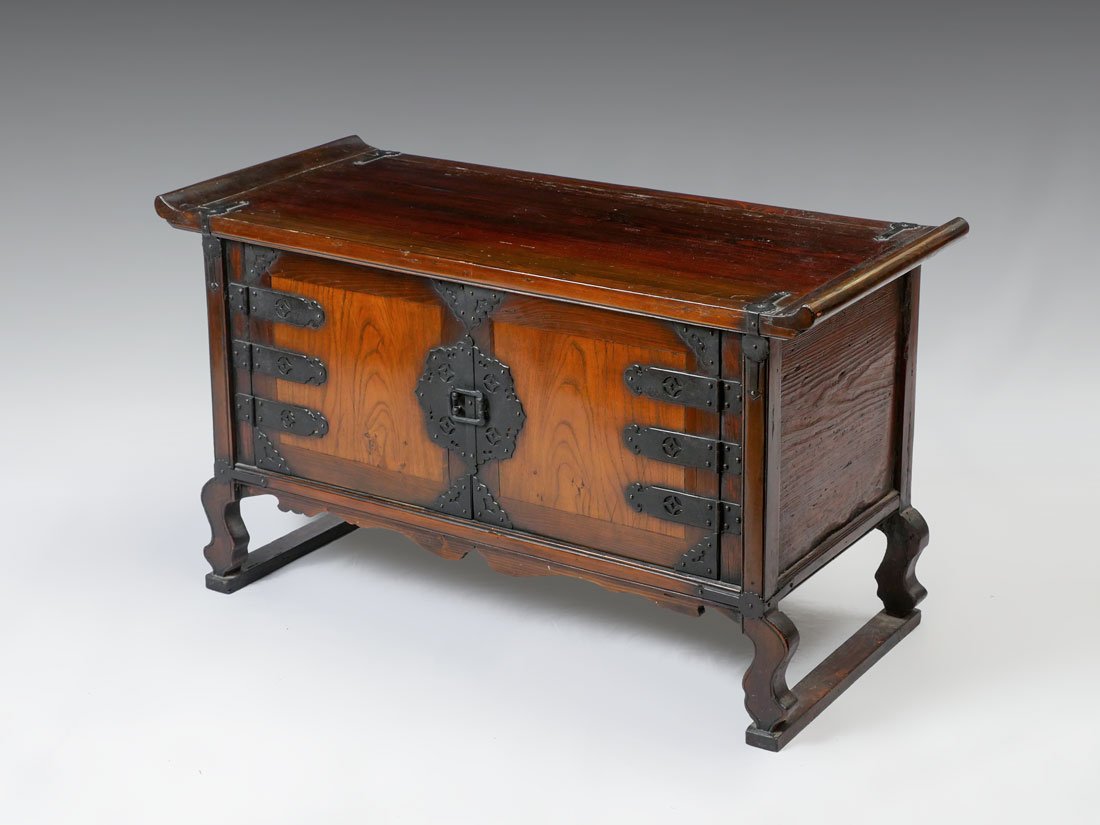 19TH CENTURY KOREAN SCHOLARS DESK: 19TH CENTURY KOREAN SCHOLARS DESK: Mid to late 19th Century, elm and pinewood low scholars desk, Chu-La Province, altar style top over 2 doors with metal fittings, shaped skirt and legs, overall 21 3/