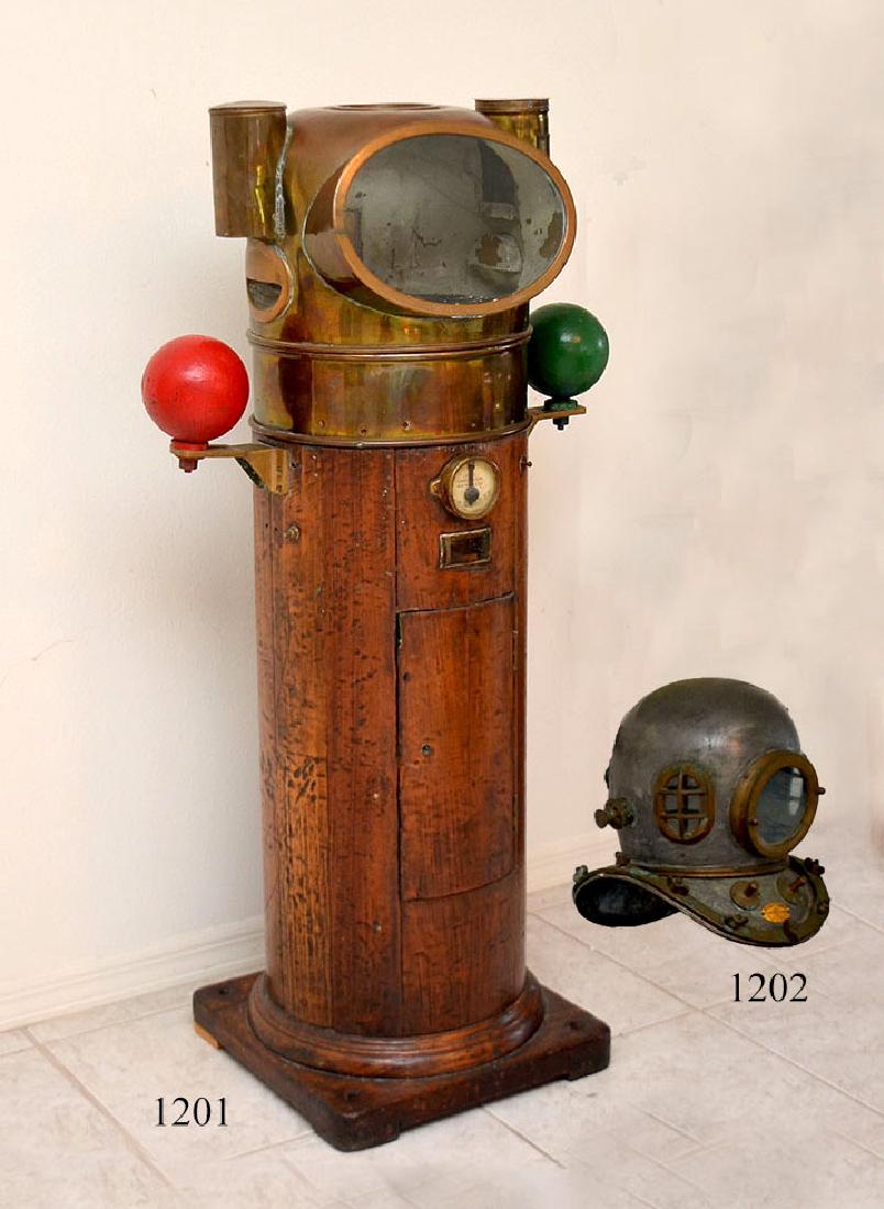 1942 LIONEL CORP. COMPENSATING SHIPS BINNACLE: 1942 LIONEL CORPORATION COMPENSATING SHIPS BINNACLE: Brass hood with round top porthole top, oval front porthole, gimbaled interior compass. Red and green indicators on either side of wood case, clino