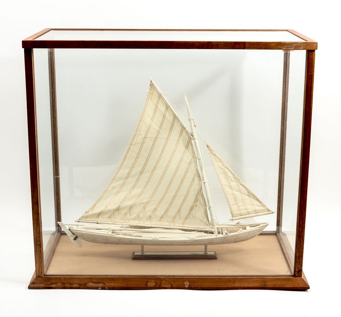 A.S. LUZ AZORES CARVED WHALE BONE BOAT: A.S. LUZ AZORES CARVED WHALE BONE BOAT: Circa later 20th century, model of a 19th century whaling vessel caved from whale bone and linen. Encased in glass display case, 23 1/2'' h. x 11 3/4'' x 9 1/4'
