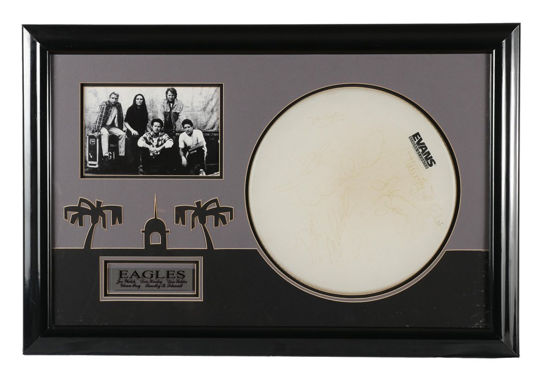 FRAMED EAGLES BAND SIGNED DRUM HEAD: FRAMED EAGLES BAND SIGNED DRUM HEAD: Evans drum head signed by 5 members of The Eagles to include Don Henley, Joe Walsh, Timothy B. Schmit, Glenn Fry, and Don Felder. Framed with picture and plaque, f