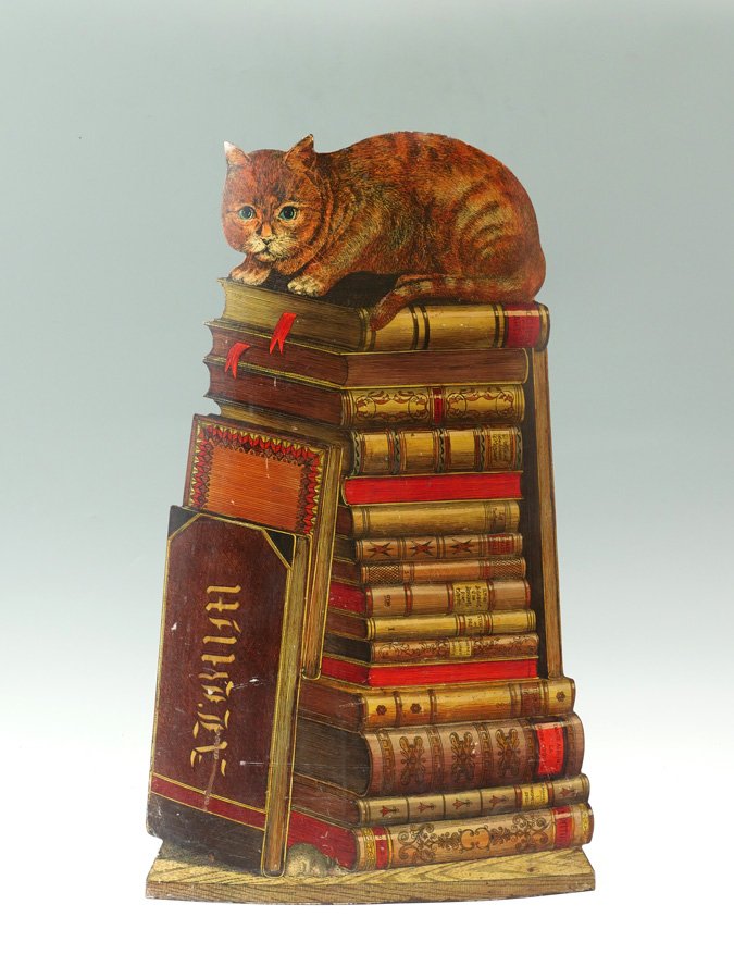 FORNASETTI CAT CORNER UMBRELLA STAND: PIERO FORNASETTI CAT ON BOOKS UMBRELLA STAND: Italian, circa 1960.
