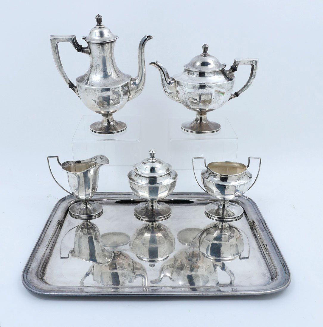 5-PIECE STERLING SILVER SERVING SERVICE WITH TRAY: 5-PIECE STERLING SILVER SERVING SERVICE WITH TRAY: Comprising an Art Deco paneled Sterling Silver Coffee Pot, Tea Pot, covered Sugar Bowl, Creamer, and a Waste Bowl. Made by the Sterling Silver Manufa