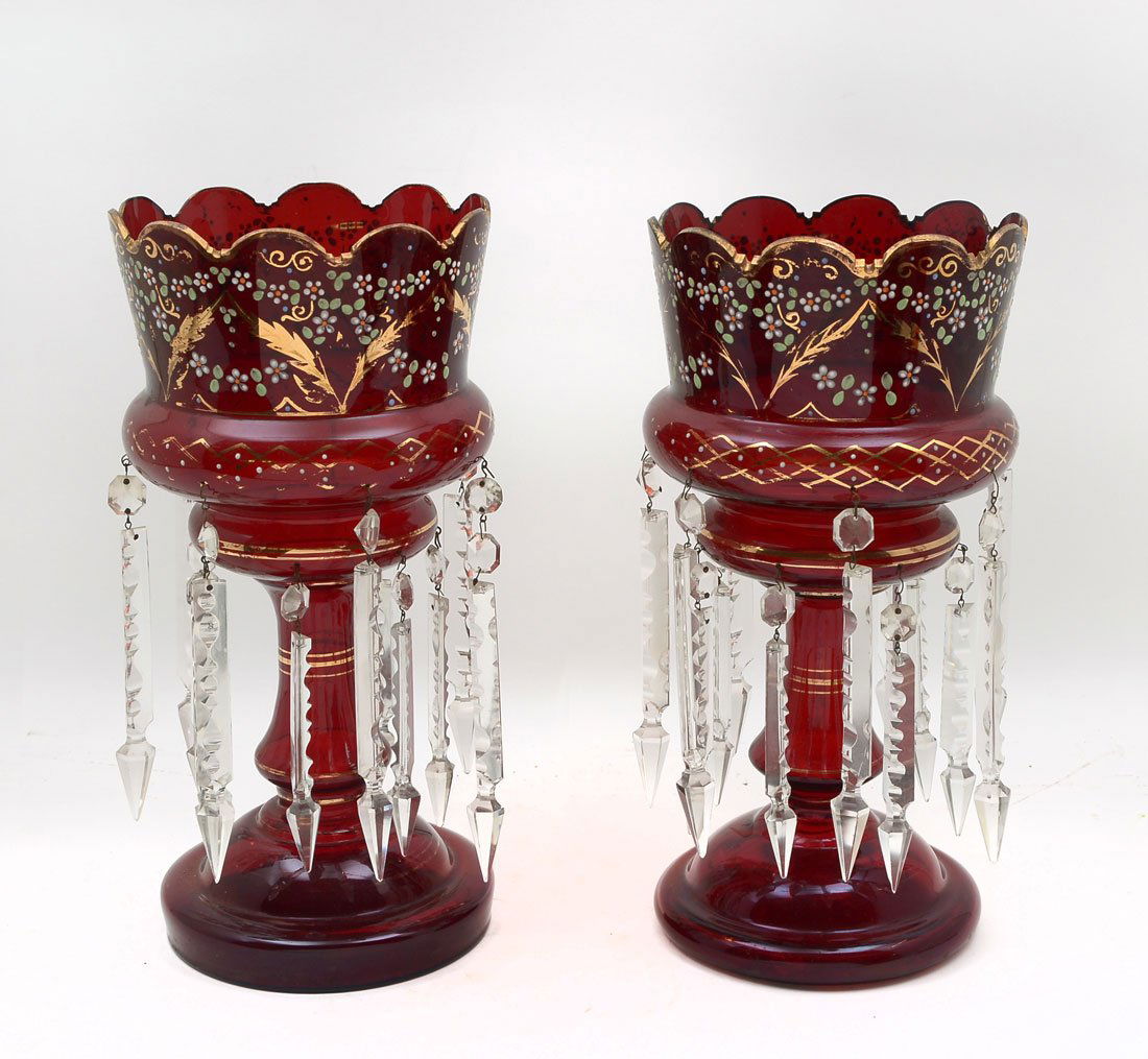 PAIR OF RUBY RED BOHEMIAN MANTLE LUSTERS: PAIR OF RUBY RED BOHEMIAN MANTLE LUSTERS: Pair of Ruby Red Bohemian mantle lusters that have been hand decorated with white enamel flowers. There are 14 spear shaped prisms on each. Approx. 14.5'' h x