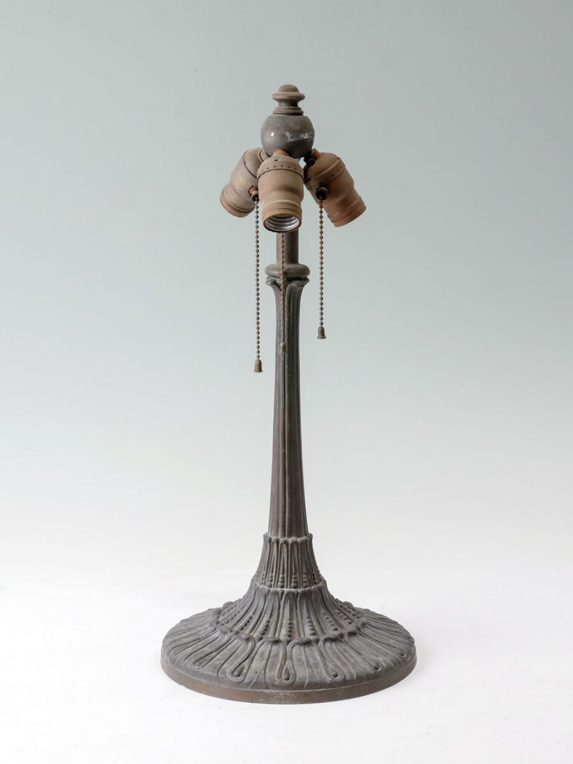 CAST BRONZE ART DECO HANDEL LAMP BASE: CAST BRONZE ART DECO HANDEL LAMP BASE: This art deco lamp base was made by Handel and has a 3-light fixture. The neck has a simple vertical line design. The base has a 3-tiered leaf design encompassin