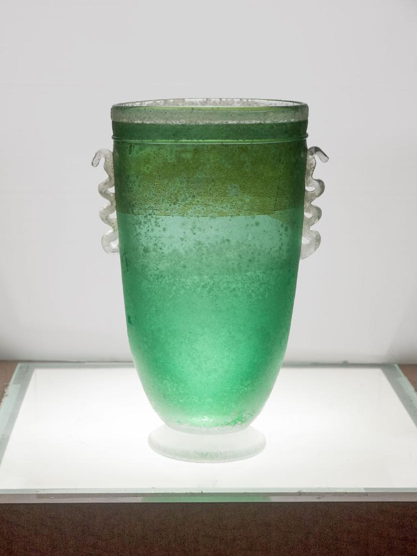 GAMBARO & POGGI MURANO SCAVO VASE: GAMBARO & POGGI MURANO SCAVO VASE: This blown glass vase was designed Gambaro & Poggi for Murano. Scavo finish applied to green body with clear attached handles. Horizontal iridescent gold flecking to