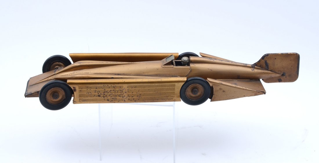 KINGSBURY GOLDEN ARROW PRESSED STEEL WIND-UP CAR: KINGSBURY GOLDEN ARROW PRESSED STEEL WIND-UP CAR: This wind-up pressed steel toy car was made circa 1930. Driver and original rubber still intact. This car was the land speed record holder in 1929. Ap
