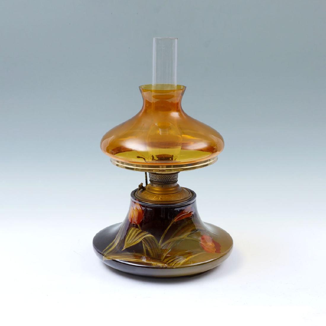 J.W. BROOKS WELLER OIL LAMP: J.W. BROOKS WELLER OIL LAMP: Painted by Albert Haubrich (1897-1903), designed by J.W. Brooks Jr., this less common Weller pottery oil lamp is signed, and hand painted in a floral and foliate motif on 