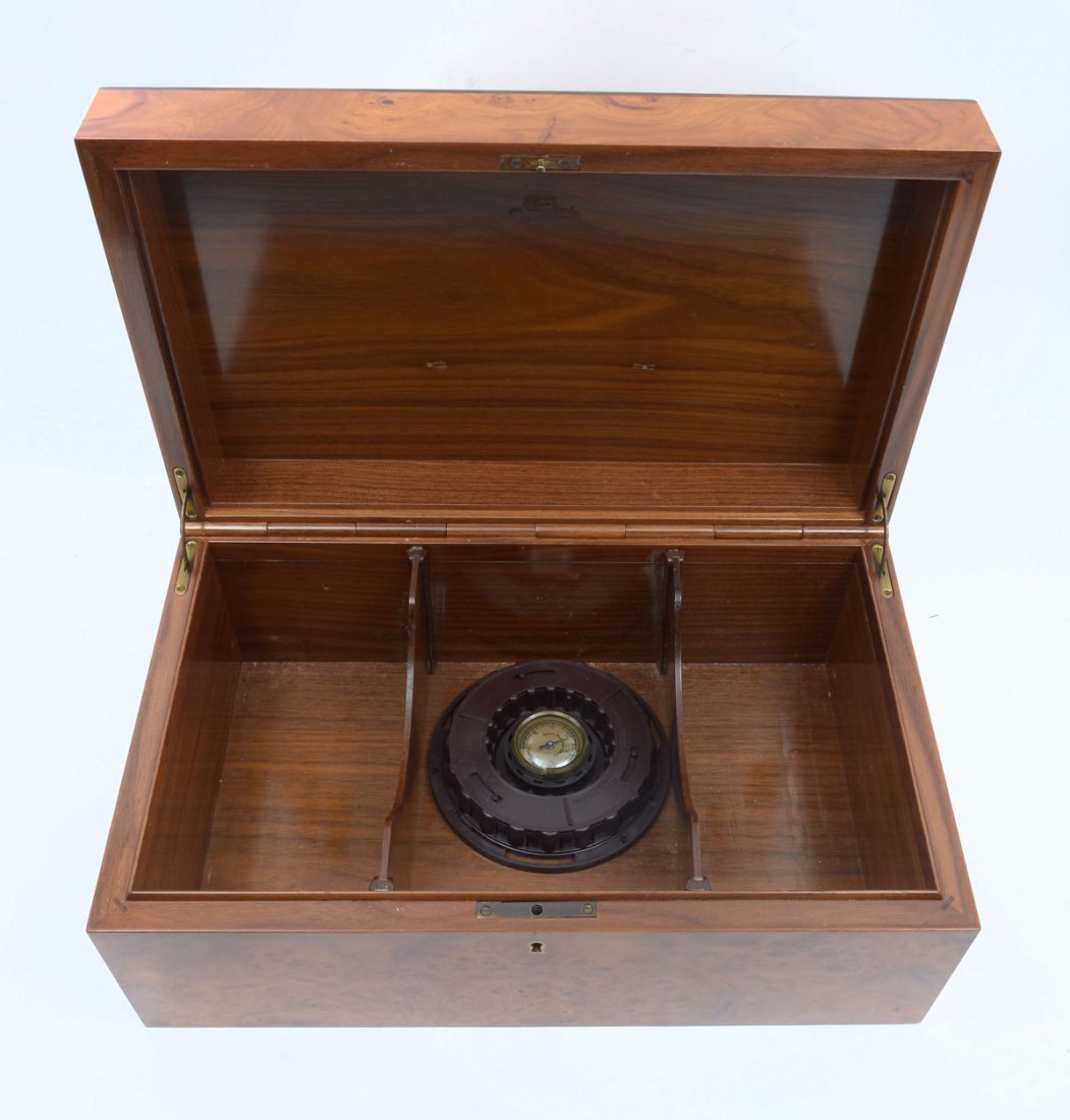 BURLWOOD HUMIDOR: BURLWOOD HUMIDOR: This burled humidor has a wooden piano style hinge with 2 movable compartment slats and brass side hinges. Lid is accented with a darker beveled border. Analog hygrometer and reservo