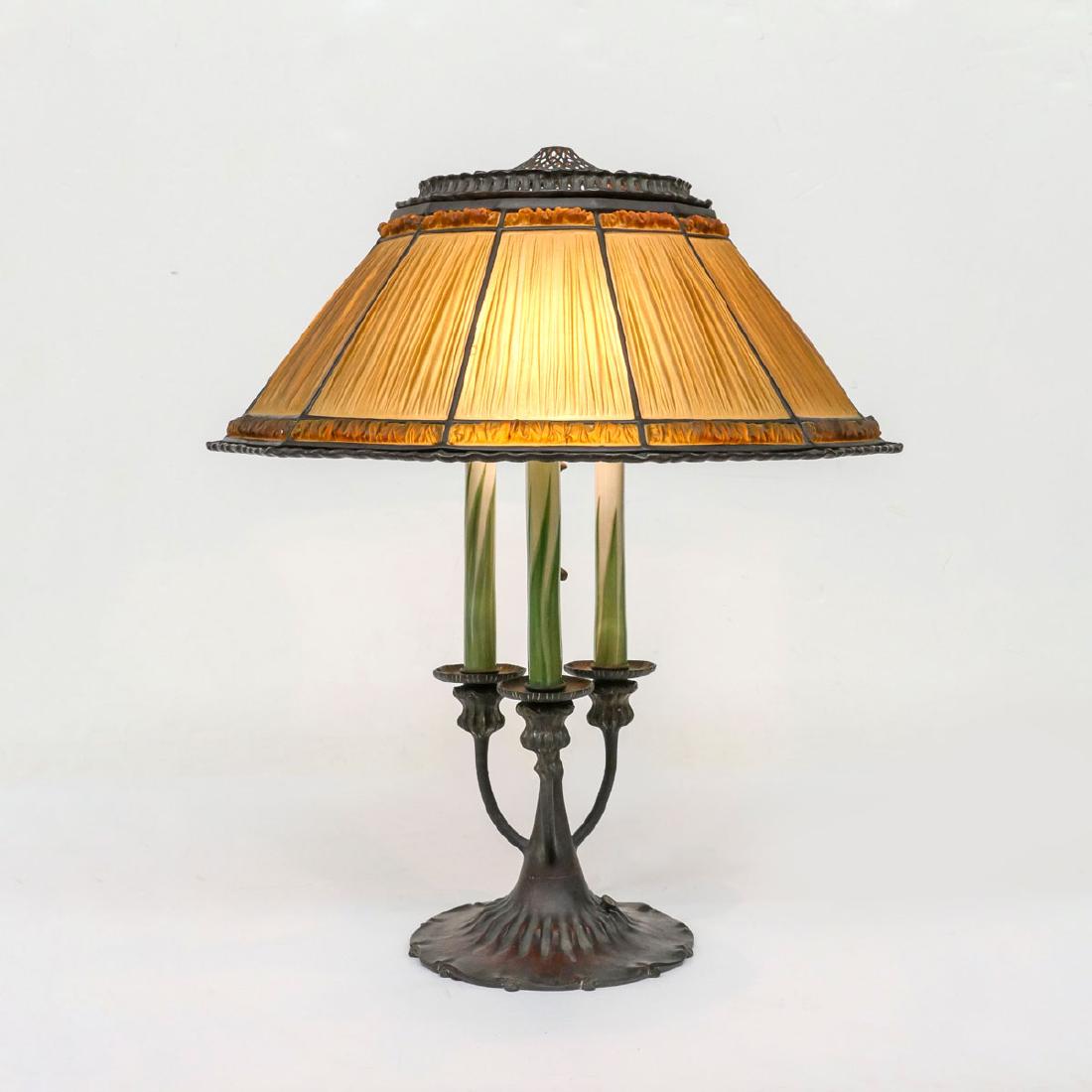 TIFFANY LINEN FOLD DESK LAMP: TIFFANY LINEN FOLD DESK LAMP: Fine Tiffany studios pulled feather green to white with amber glass linen fold shade. Base has impressed Tiffany studios # 580 underside of base and shade has Tiffany stu