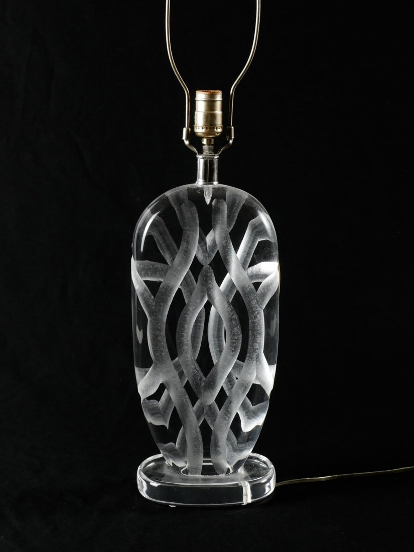 VAN TEAL SIGNED LUCITE TABLE LAMP: VAN TEAL SIGNED LUCITE TABLE LAMP: Geometric engraved Lucite table lamp attached to a Lucite base that is signed Van Teal. Rectangular Lucite finial atop. Approx. 30" h x 7" l x 5" w.