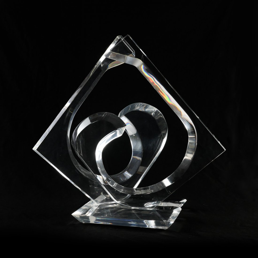 VAN TEAL SIGNED LUCITE SCULPTURE: VAN TEAL SIGNED LUCITE SCULPTURE: Curved & beveled Lucite sculpture with 2 attached opposing pieces to base that has been signed Van Teal. Approx. 24.75" h x 24" l x 17" w.