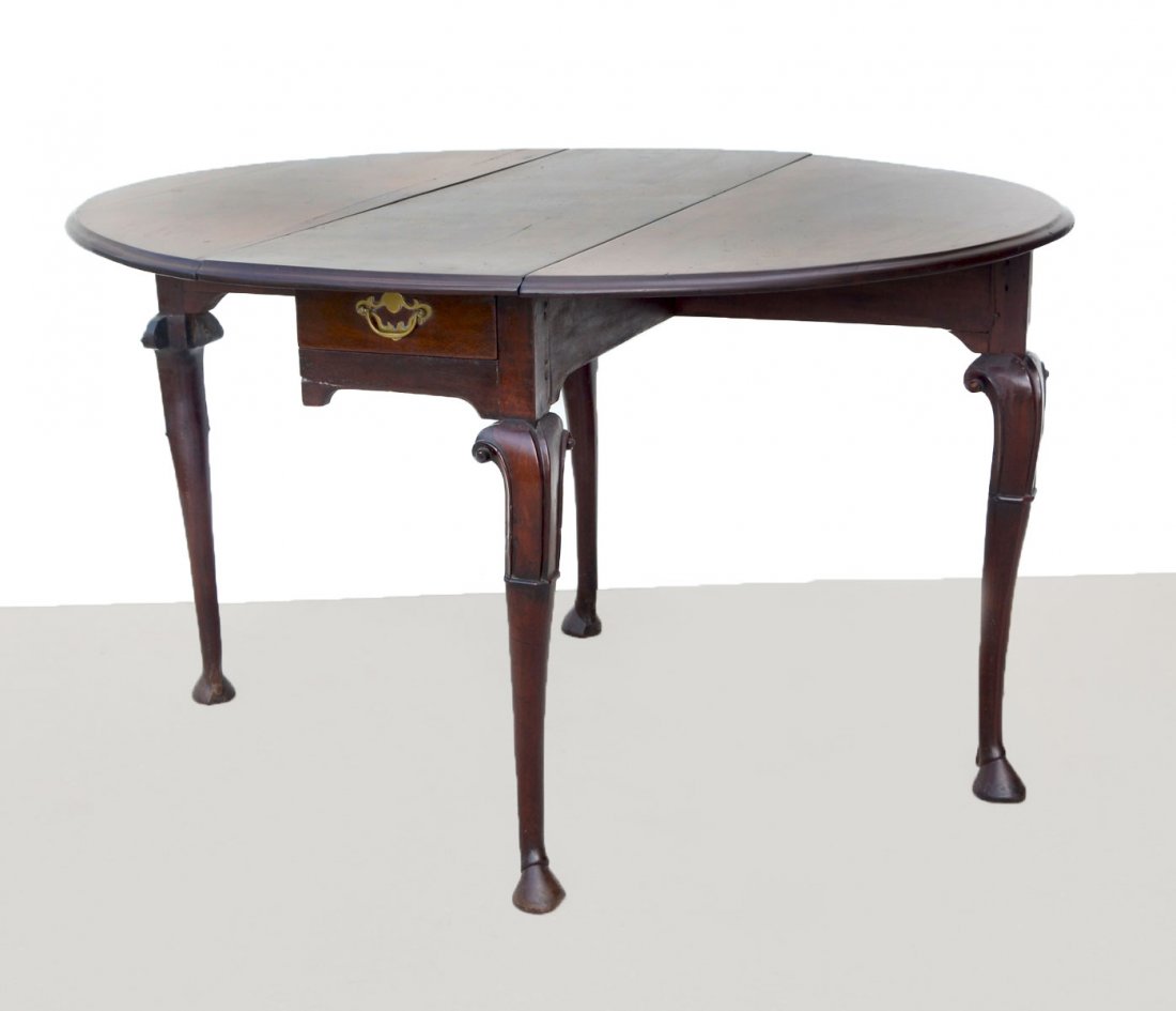 18TH CENTURY DUTCH QUEEN ANNE MAHOGANY DROP-LEAF TABLE: 18TH CENTURY DUTCH QUEEN ANNE MAHOGANY DROP-LEAF TABLE: Circa 1740 carved Dutch drop-leaf table with single drawer. Cabriole legs with carved scrolled brackets on hoven feet. 2 of the legs swing 90 de