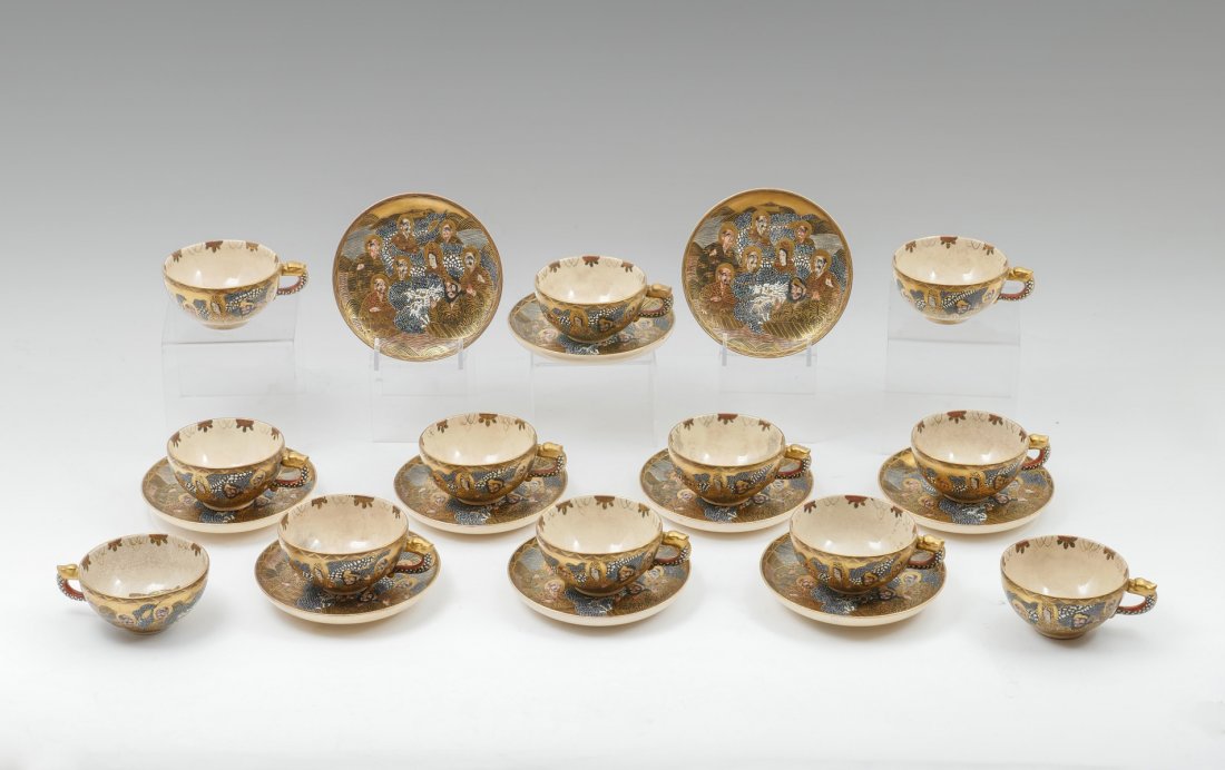MEIJI PERIOD DAI NIPPON SATSUMA HODOTA CUPS & SUAC: MEIJI PERIOD DAI NIPPON SATSUMA HODOTA CUPS & SUACERS: Comprising 12 saucer plates decorated with a white dragon amongst Arhats in a heavily gilt paint, gold on crimson mark underside that reads Dai N