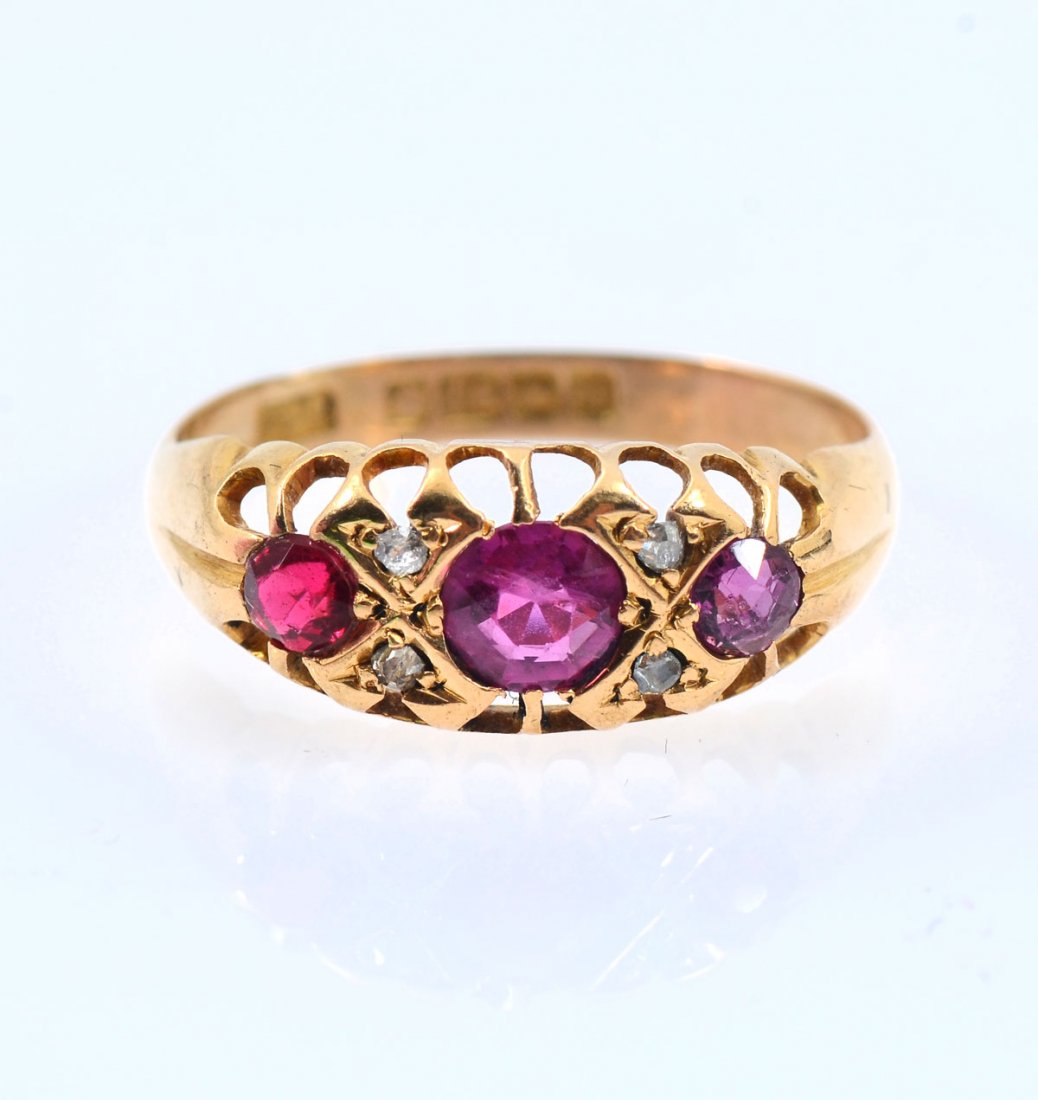18K ANTIQUE RUBY RING: 18K ANTIQUE RUBY RING: 18K yellow gold antique ring contains 2 native cut rubies. WEIGHT: .40 Ct. Approx. One round faceted red stone of unknown origin (replacement) The stones are bead and Belcher se