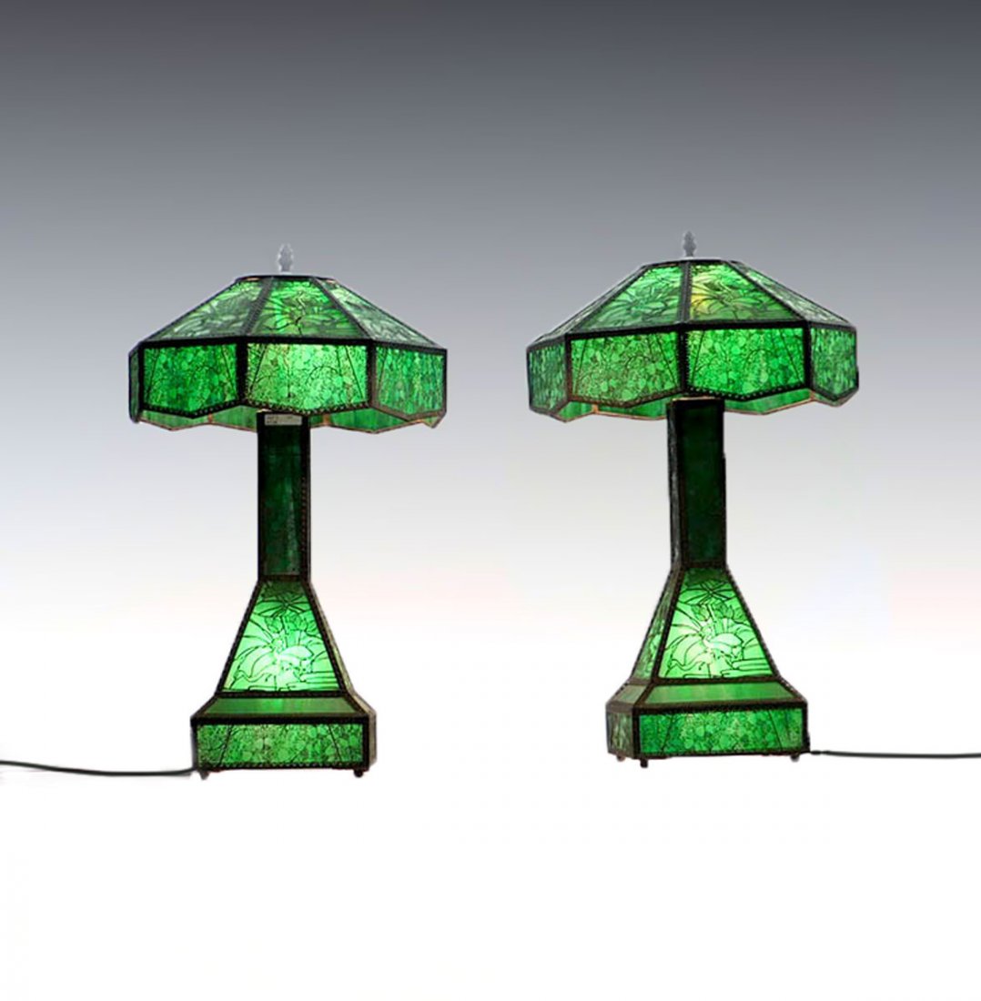 PAIR OF ETCHED METAL OVERLAY TABLE LAMPS: PAIR OF ETCHED METAL OVERLAY TABLE LAMPS: Attributed to Riviere Studios this pair of green slag glass with ornate etched metal overlay having scenes of floral & storks in a pond scene. Approx. 25.75"