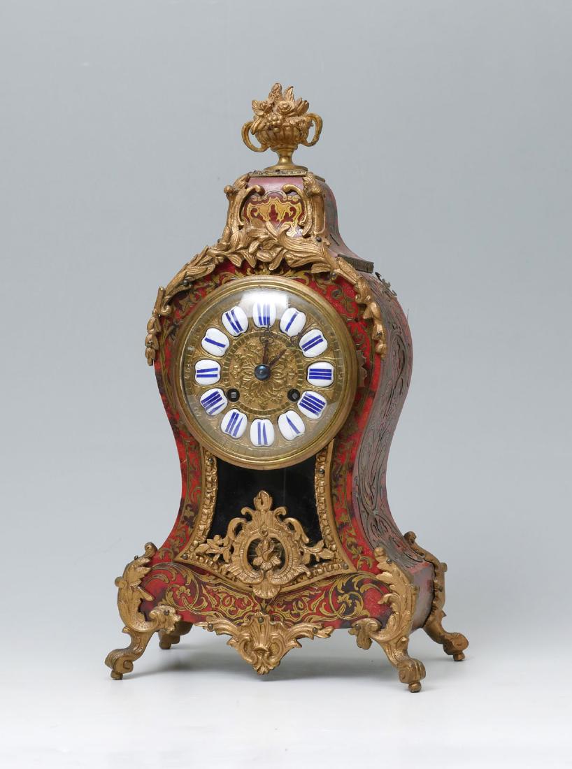 19TH CENTURY FRENCH GILT ORMOLU BOULLE TORTOISE SH: 19TH CENTURY FRENCH GILT ORMOLU BOULLE TORTOISE SHELL: French gilt scrolling foliate ormolu adorning a Boulle inlaid tortoise shell veneered mantle clock. Blue roman numeral enamel between ornate gilt