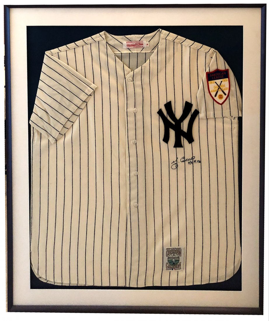 YOGI BERRA SIGNED JERSEY IN FRAME: YOGI BERRA SIGNED JERSEY IN FRAME: 1951 New York Yankees jersey made by Mitchell & Ness of New Jersey. Signed under the NY "Yogi Berra, H.O.F. 72". Yogi Berra (1925-2015) was MVP for the American leag
