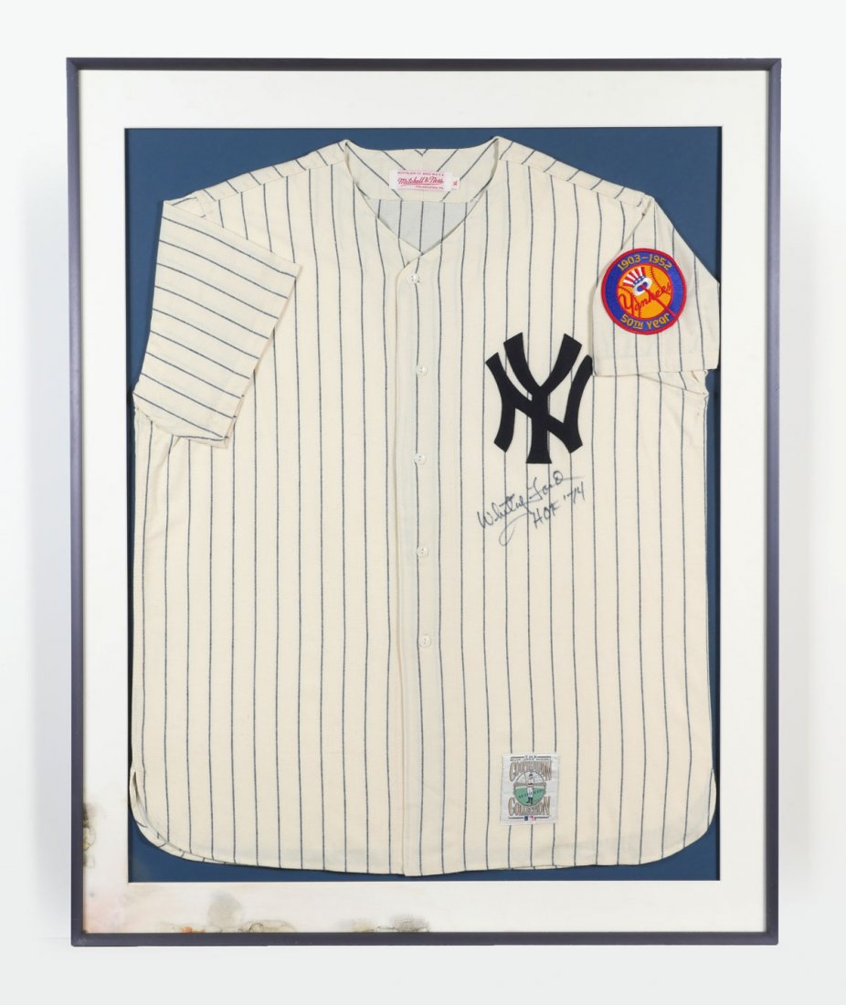 WHITEY FORD SIGNED JERSEY IN FRAME: WHITEY FORD SIGNED JERSEY IN FRAME: 1952 New York Yankees jersey by Mitchell & Ness. Signed under NY "Whitey Ford, H.O.F. 74. Whitey Ford (b. 1928) still holds the franchise pitching record of 236-106