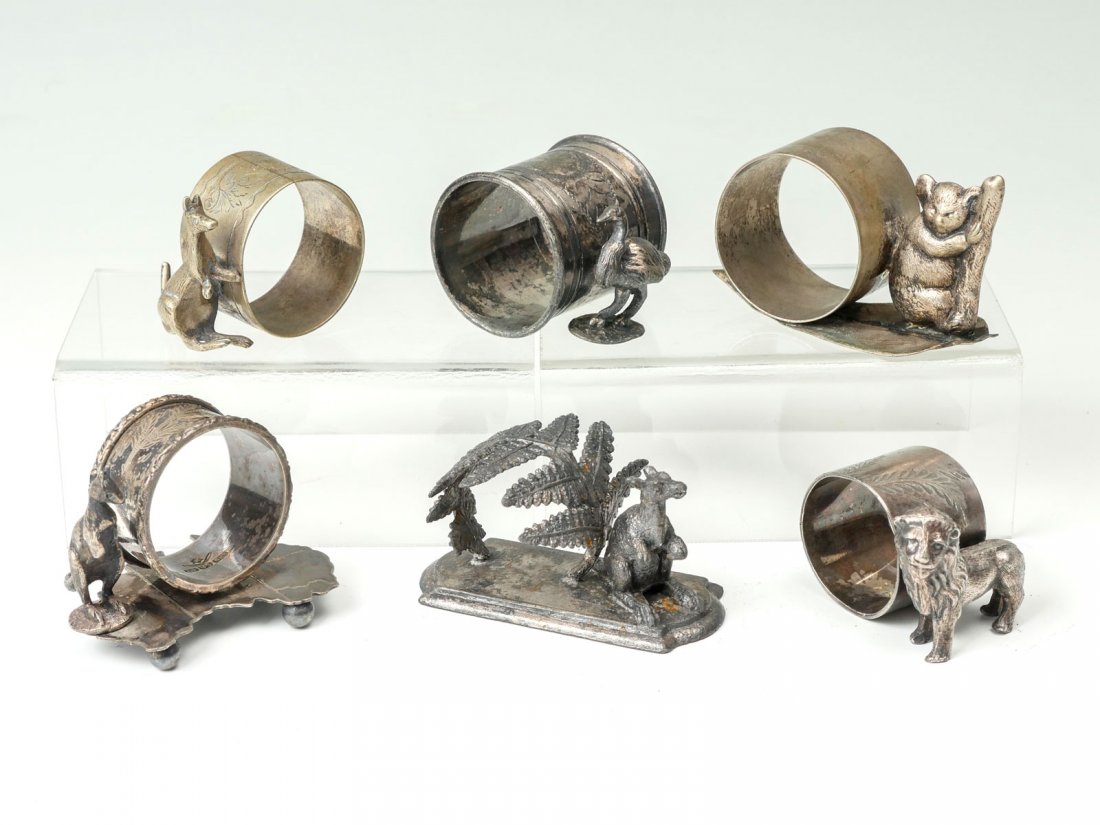 6 PC. FIGURAL NAPKIN RINGS: 6 PC. FIGURAL NAPKIN RINGS: 1- Kangaroo with fern shaped holder by Philip Ashberry & Sons, 1- Kangaroo etched holder with barely legible mark, 1- Kangaroo holder with both being mounted to an Australi