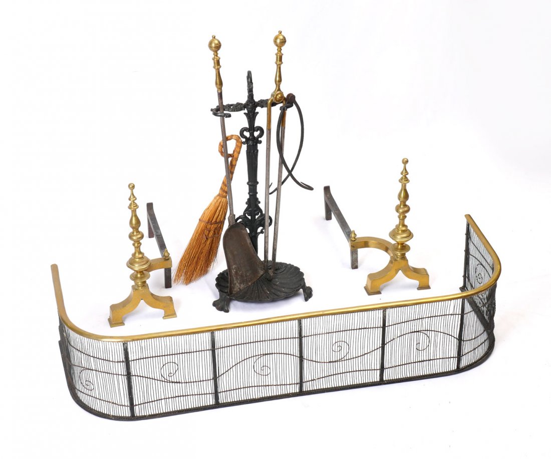 A PAIR OF BRASS ANDIRONS: PAIR OF BRASS ANDIRONS & ANTIQUE FIREPLACE FENDER: Brass andirons circa 1900, and a circa 1820, American Wire in brass frame fireplace fender. Andirons Approx. 17.25'' h x 19.25'' l x 9'' w. Fender Ap