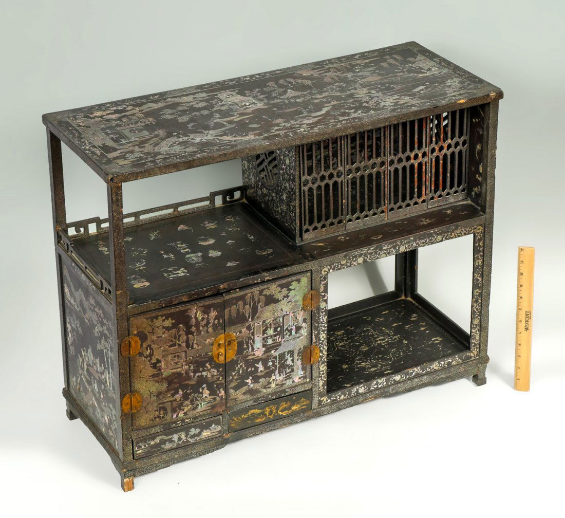 ELABORATELY INLAID ABALONE JAPANESE CABINET: ELABORATELY INLAID ABALONE JAPANESE CABINET: Elaborately inlaid abalone Japanese bird cage cabinet, having 4 removable panels at top right and a 2-door cabinet at lower left. Inlaid figural court scen