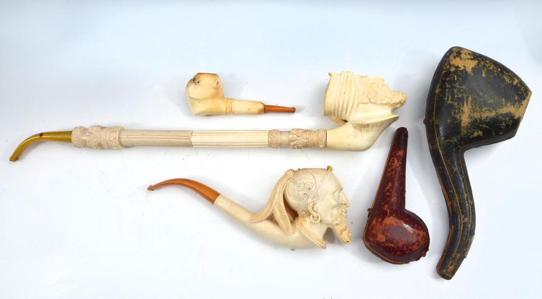 3 PC. EARLY MEERSCHAUM FIGURAL PIPES: 3 PC. EARLY MEERSCHAUM FIGURAL PIPES: Comprising 1- long bearded figure residing in a case, 1- broad bearded figure having a long 2 pc. smoke shaft, & 1- in the form of a dog having inset black eyes,