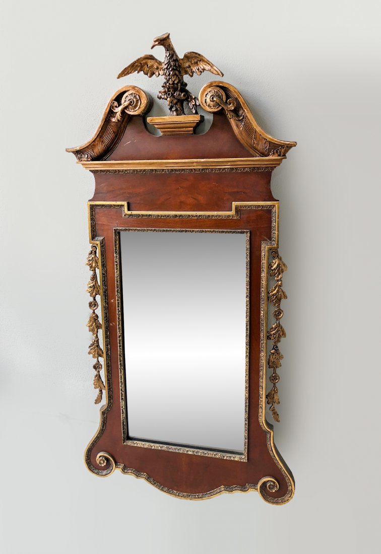19TH CENTURY EAGLE WALL MIRROR: 19TH CENTURY EAGLE WALL MIRROR: Surmounting carved Eagle & acorns, flanked by scrolling foliate crests, over mirror having foliate borders. Draped foliate at sides. Approx. 58.75" h x 29" w.