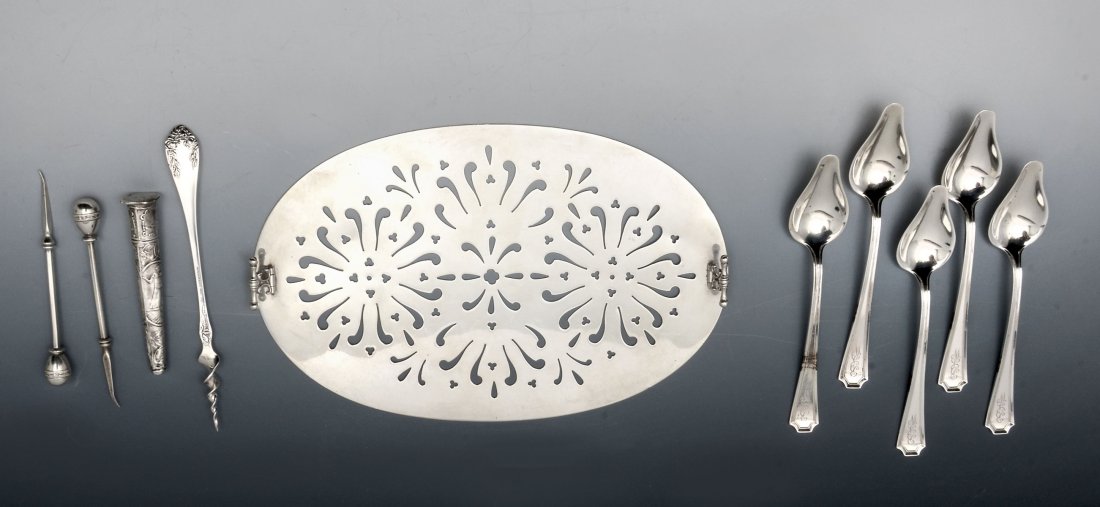 STERLING TRIVET, SPOONS, & MISC. PIECES: STERLING TRIVET, SPOONS, & MISC. PIECES: Comprising 1- pierced Whiting Manufacturing Co. trivet having folding feet, 5- Sterling monogrammed honey spoons, 2- Sterling picks, 1- Roger Williams cork scr
