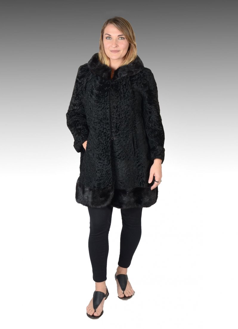 VINTAGE BLACK PERSIAN LAMB JACKET: VINTAGE BLACK PERSIAN LAMB JACKET: Very Jackie O! Black Persian lamb 3/4 length jacket has mink trim at the collar and the hem. Approx size 6-8. 2 hook & eye closures and 2 side slit pockets. Black sa