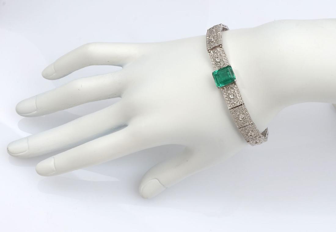 8.43 CT EMERALD & DIAMONDS IN 18K BRACELET: 8.43 CT EMERALD & DIAMONDS IN 18K BRACELET: 8.43 CT emerald is featured in this 18k white gold bracelet complimented with 3.00 CTW diamonds. Weight approx 20.3 grams. 7.5'' in length. Sold with curren