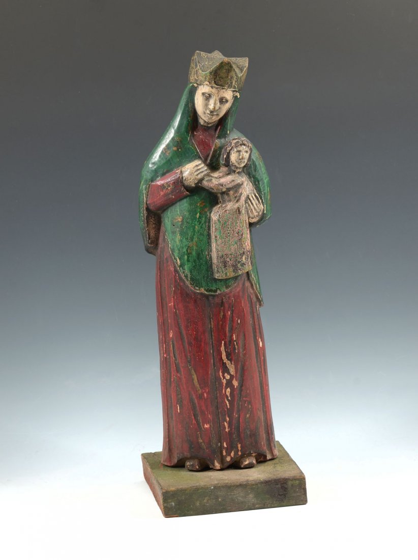 EARLY CARVED MADONNA: EARLY CARVED MADONNA: Late 18th century, possibly older carving of Madonna and child. Polychrome finish mounted on square wood base. 2 nails at back neck, probably mounted at one point. Approx. 14.75"