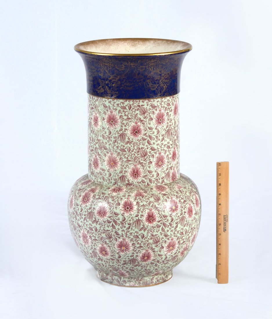 DOULTON BURSLEM UMBRELLA STAND/VASE: DOULTON BURSLEM UMBRELLA STAND/VASE: Tall Doulton Burslem umbrella stand/vase having a gold flared rim with a flower & foliate design. Impressed Doulton mark & stamp reside at underside. Approx. 23" h