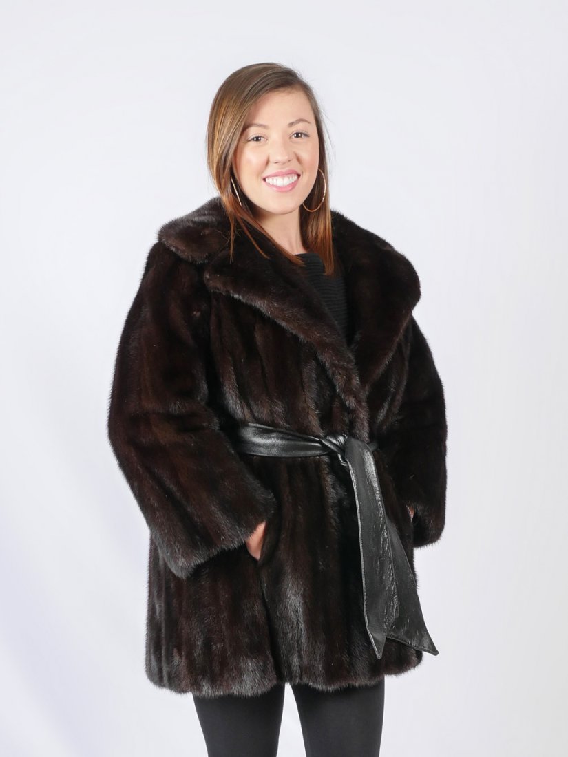 VINTAGE MAHOGANY MINK JACKET WITH LEATHER BELT: VINTAGE MAHOGANY MINK JACKET WITH LEATHER BELT: Well cared for mink is very stylish with pull through leather belt, button closure at the neck and 3 hook and eye closures down front. Side slit pockets
