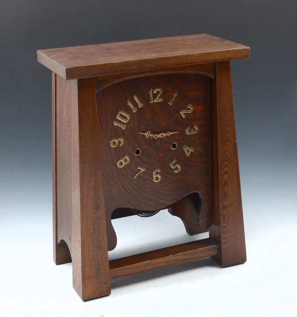 PAINE ARTS AND CRAFTS CLOCK: PAINE ARTS AND CRAFTS CLOCK: Paine Furniture Co. arts & crafts oak mantle clock having attached brass numbers. Approx. 16.75" h x 13.5" l x 7" w.