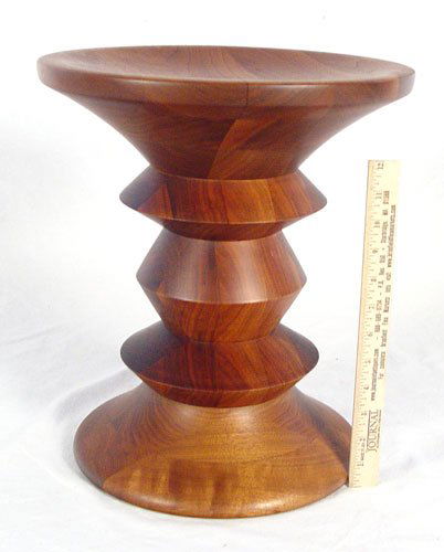 HERMAN MILLER EAMES TIME LIFE STOOL: HERMAN MILLER EAMES TIME LIFE STOOL: Designed by Ray Eames for the lobby of the Time-Life building in New York. Can be set with either side up. Solid walnut construction. Measures 15'' high x 13'' top