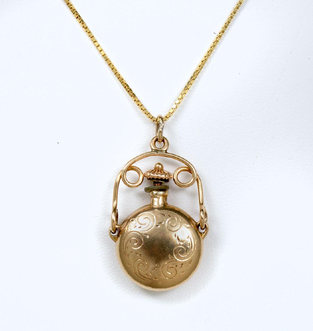 EDWARDIAN 14K SCENT BOTTLE PENDANT ON CHAIN: EDWARDIAN 14K SCENT BOTTLE PENDANT ON CHAIN: Edwardian 14K yellow gold scent bottle makes an interesting pendant on this 20'' box chain necklace. Weight 7.7 grams. Bottle functions and unscrews with a