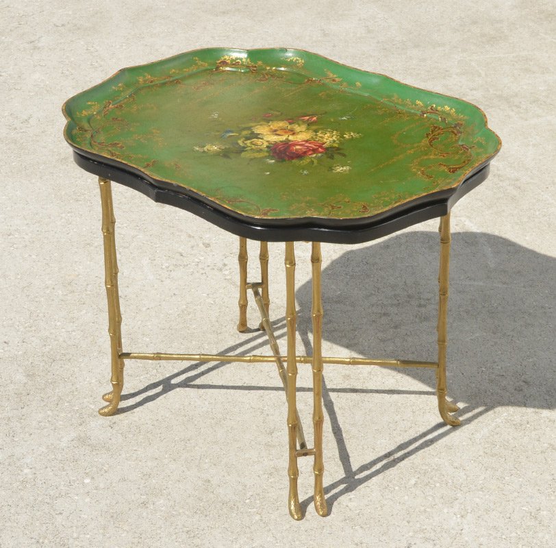 TOLE DECORATED TEA TRAY TABLE: TOLE DECORATED TEA TRAY TABLE: Removable tray top with green ground and floral and gilt toleware decoration. Black lacquer table top over brass faux bamboo legs and stretcher, marked Crow on base of o