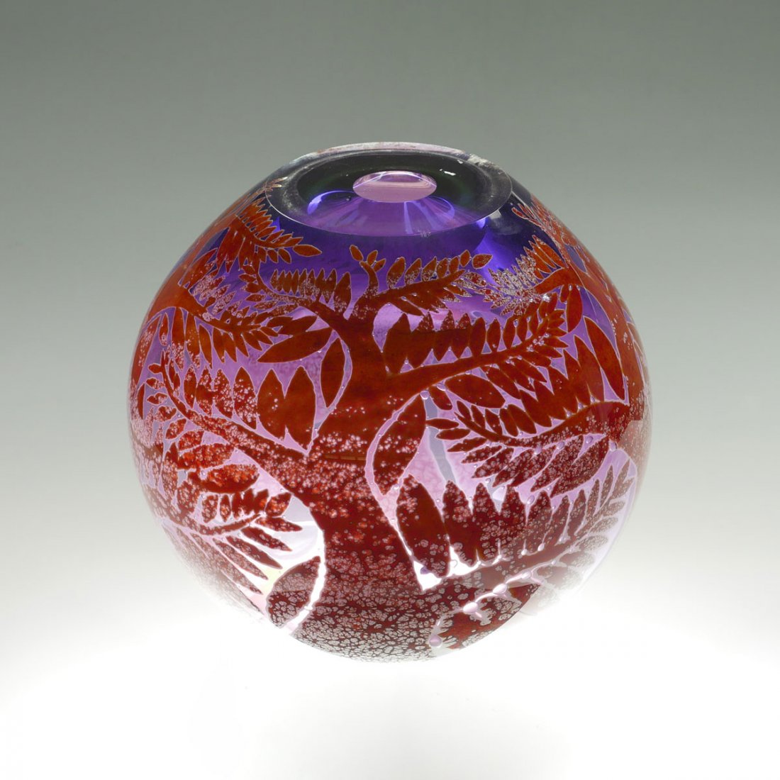 DUNCAN MCCLELLAN VASE: DUNCAN MCCLELLAN VASE: Purple ground glass round, ovoid in form, having a tree motif with a mottled red, orange, & yellow. Etched Duncan McClellan at underside. Approx. 10.5" h x 12" w.
