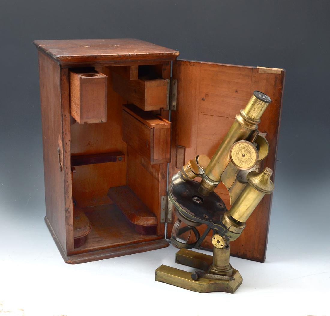 ERNST LEITZ WETZLAR MICROSCOPE WITH ORIGINAL CASE: ERNST LEITZ WETZLAR MICROSCOPE WITH ORIGINAL CASE: Late 19th Century Microscope by Ernst Leitz Wetzlar in Original case having sliding compartments that have glass slides & 2 compartments with spaces 