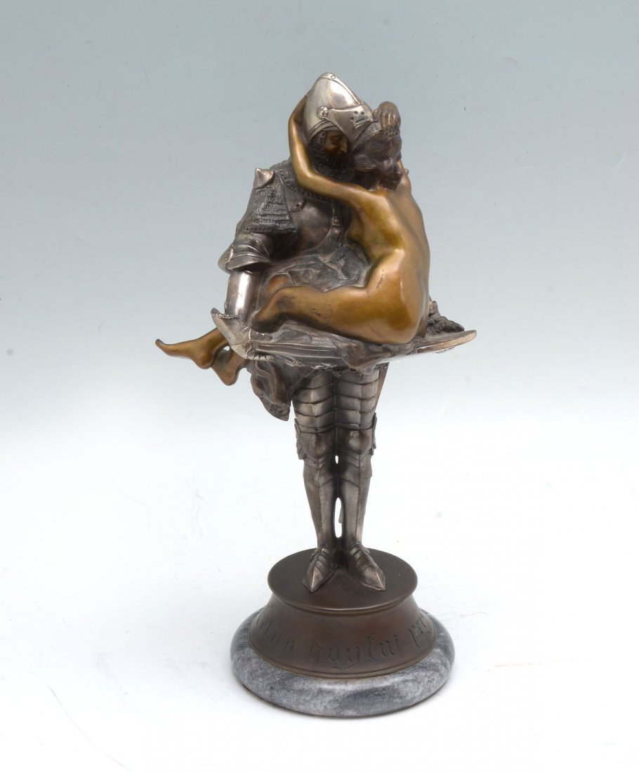 CLEMENCIN EROTIC BRONZE: CLEMENCIN, Francois, (French, 1878-1950): Erotic Bronze and Silvered Metal Grouping of a Knight in Armor and Young Nude Nymph, 14.5" h., affixed to marble plinth, 15.5" overall, signed on the base.