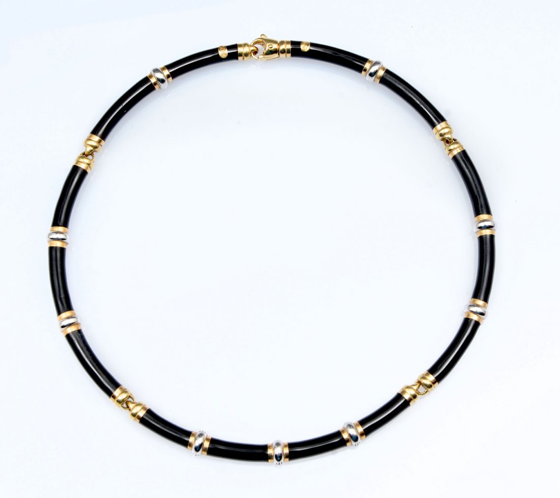 18K & DIAMOND BLACK ENAMELED CHOKER BY SOHO: 18K & DIAMOND BLACK ENAMELED CHOKER BY SOHO: Black enamel over 18K white gold and accented with yellow gold rings in 5 links to form a 17" necklace. Center link is3.5" in length and the 3 yellow gold 