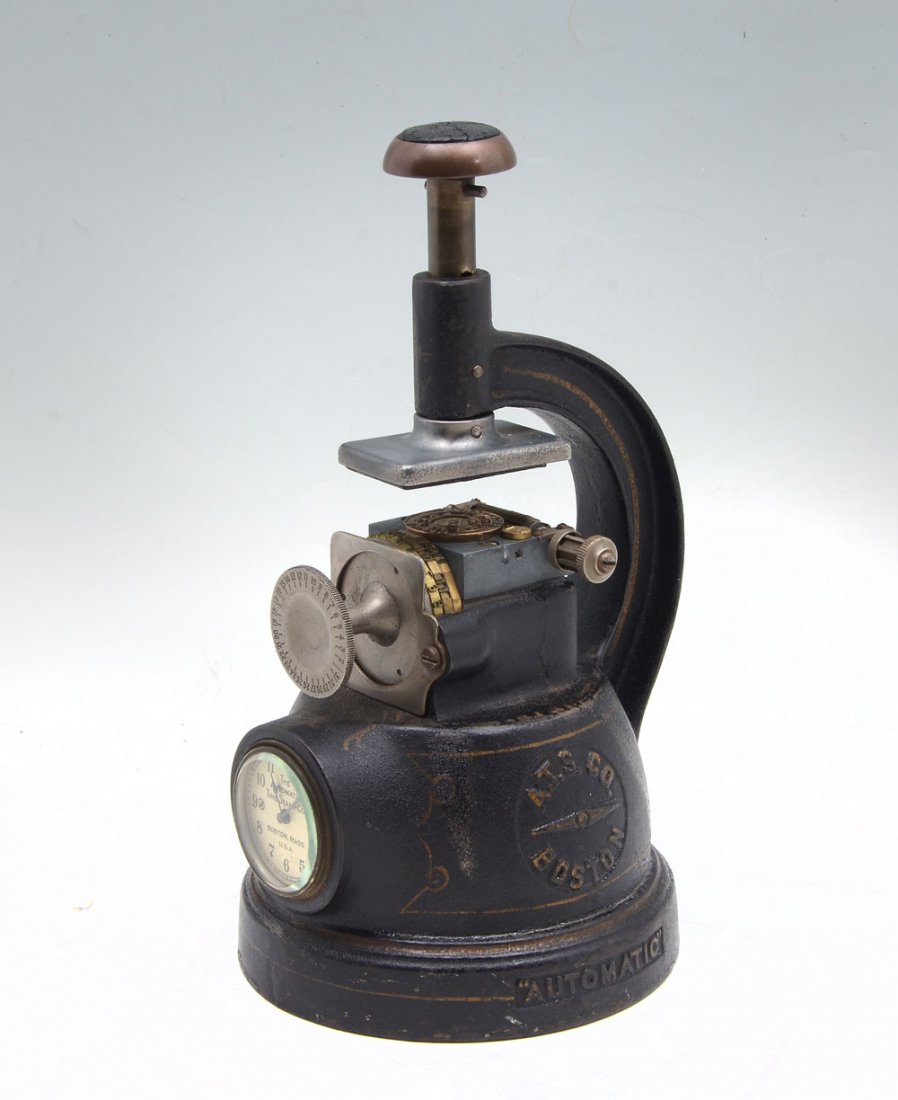 19TH C. AUTOMATIC TIME STAMP CO. TIME CARD PUNCH CLOCK: 19TH C. AUTOMATIC TIME STAMP CO. TIME CARD PUNCH CLOCK: Cast iron time card punch clock made by the Automatic Time Stamp Co. of Boston. Also included is the original ink ribbon. Approx. 11.5" h x 6.25