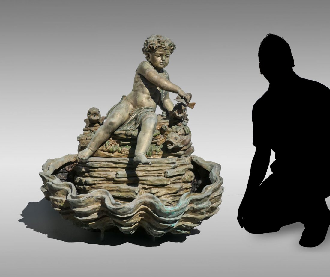 S. KELIAM CAST BRONZE CHERUB FOUNTAIN: S. KELIAM CAST BRONZE CHERUB FOUNTAIN: Cast bronze fountain having a surmounting cherub with a painted floral crown resting on a rock wall, flanked by dolphin fish and foliate. Large clam shaped base.