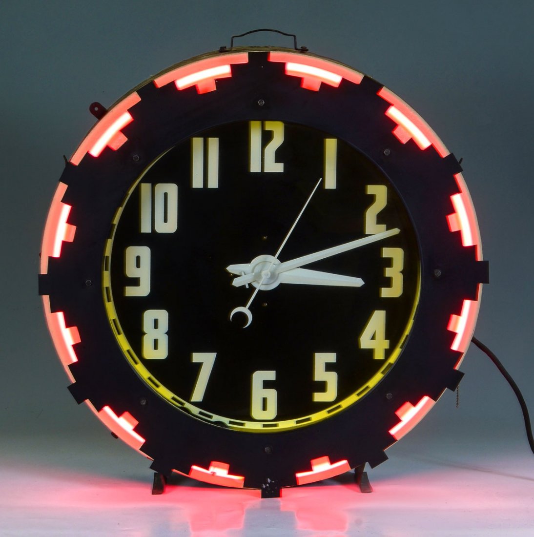 MID CENTURY NEON AZTEC CLOCK