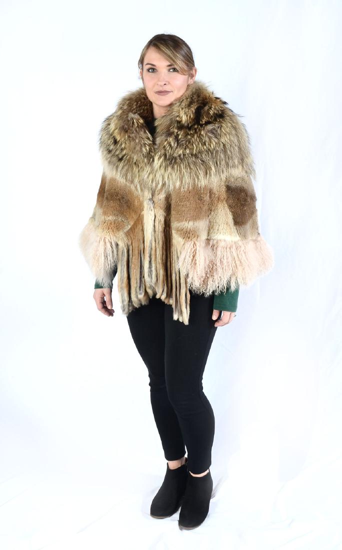 MARCELLE DANAN FOX & POLAR SHEEP CAPE/ STOLE: MARCELLE DANAN FOX & POLAR SHEEP CAPE/ STOLE: Interesting blend of textures, colors and fur are composed to make this unique fur cape. 2 Hook & eye closures at the neck. Brown satin lining. Size small
