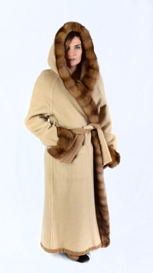 REVERSIBLE CAMEL HAIR COAT WITH FUR TRIMMED HOOD: REVERSIBLE CAMEL HAIR COAT WITH FUR TRIMMED HOOD: As soft and warm as you would expect camel hair to be. Latte color on one side and mocha on the other with a two tone camel hair belt. Fur trim round 