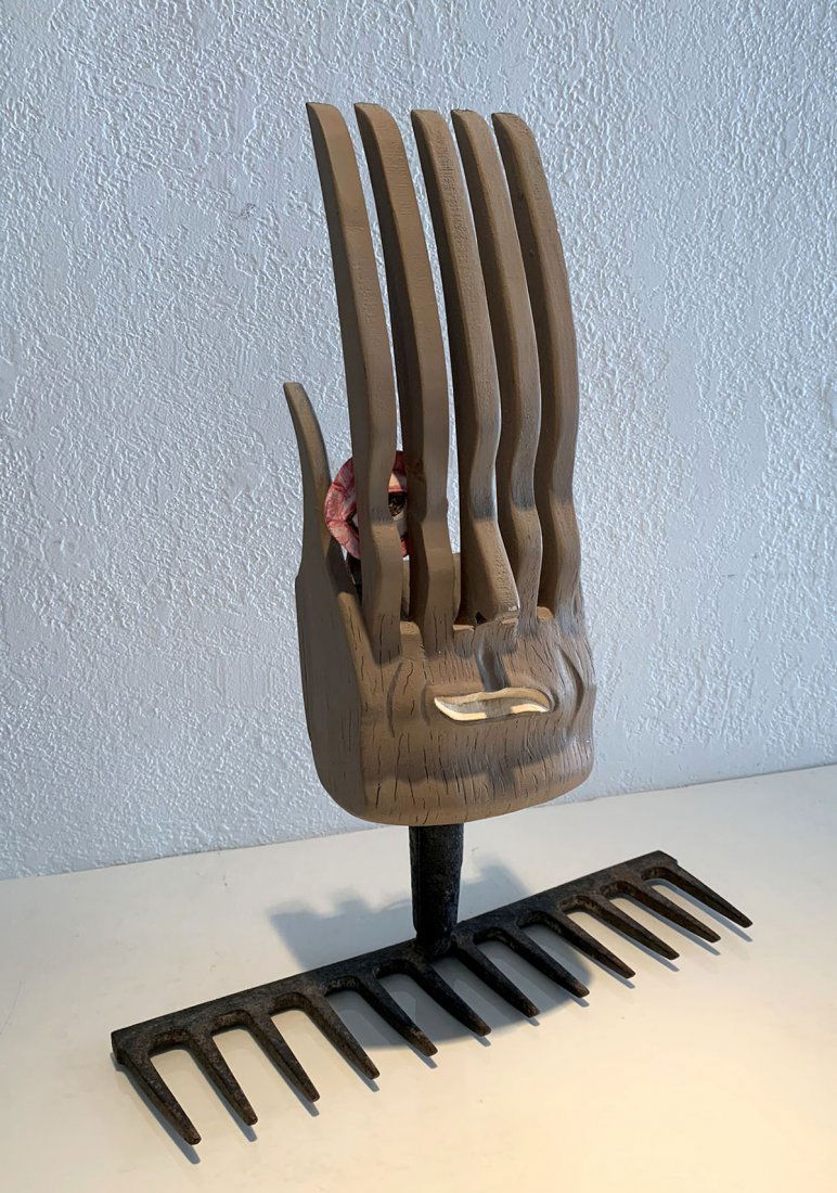 UNUSUAL CARVED WOOD AND METAL RAKE SCULPTURE: UNUSUAL CARVED WOOD AND METAL RAKE SCULPTURE: "When Garden Tools Dream", monogrammed EWL and dated 2006, measures approximately 17" in height, 13.25" in width.