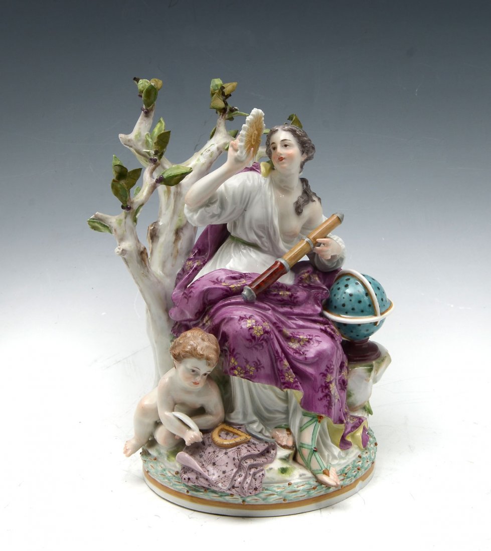 MEISSEN PORCELAIN FIGURAL GROUPING: MEISSEN PORCELAIN FIGURAL GROUPING: A scholarly semi-nude woman and child with maps, globe, & telescope resting by a tree. Underside bares the blue Meissen crossed swords mark. Approx. 7.75" h x 6" l