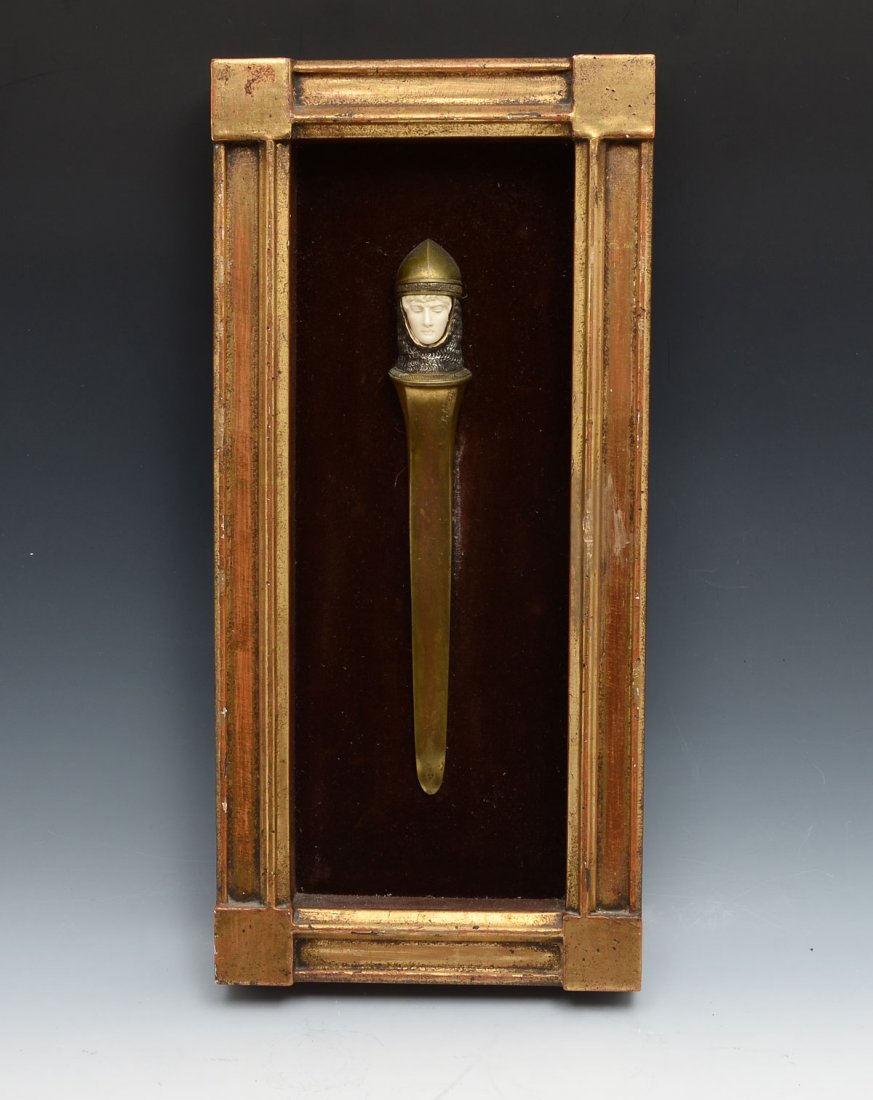 ITALIAN "POZZI" ART NOUVEAU DORE BRONZE LETTER OPENER: ITALIAN "POZZI" ART NOUVEAU DORE BRONZE LETTER OPENER: Circa 1890 Art nouveau dore bronze letter opener in the form of a knight having a carved face and Silvered bronze chainmail. Incised signature. M