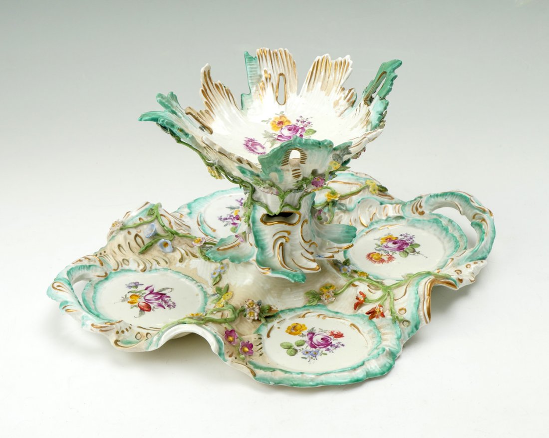 PORCELAIN TIERED CONDIMENT SWEETMEAT CENTERPIECE: PORCELAIN TIERED CONDIMENT SWEETMEAT CENTERPIECE. Rococo design with hand painted floral decoration, crossed swords mark with line, possibly Samson. Approx. 8.5" h x 16.25" l x 13.25" w. Estate of Dr.